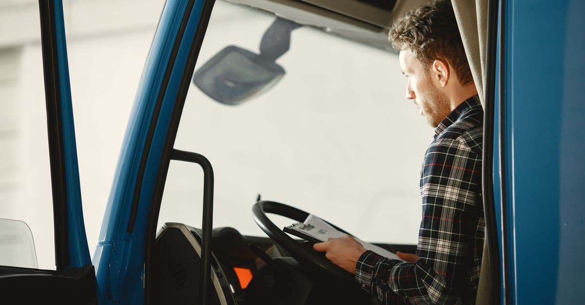 Commercial driver seated in a truck cab