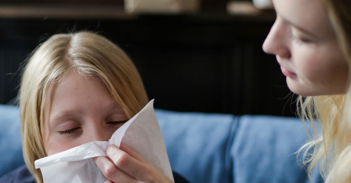 Mother caring for a sick child at home